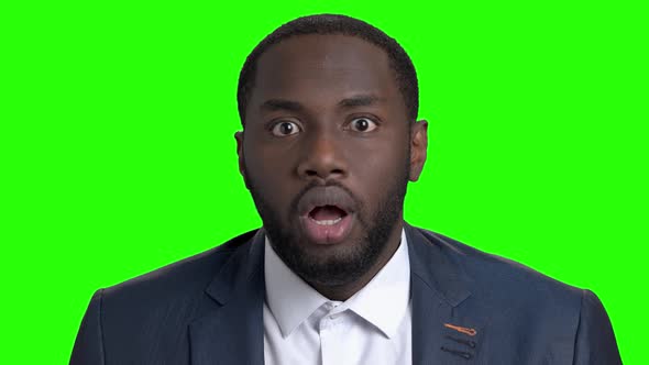 Shocked Afro American Businessman on Green Screen.
