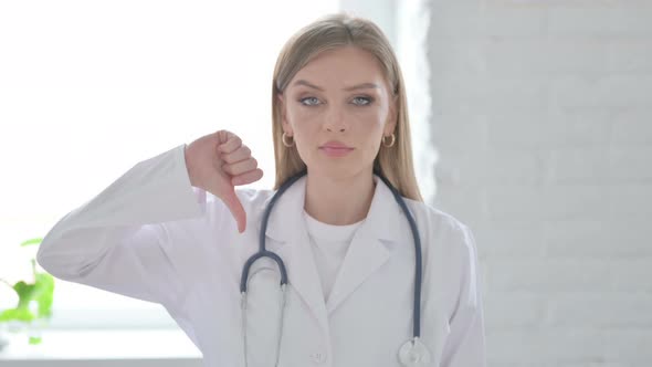 Portrait of Lady Doctor Showing Thumbs Down Gesture