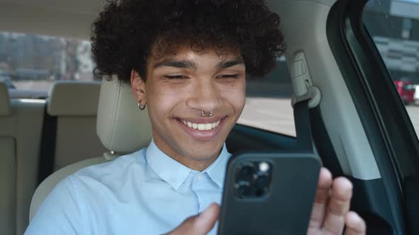 Closeup Guy Typing Mobile Phone in Car