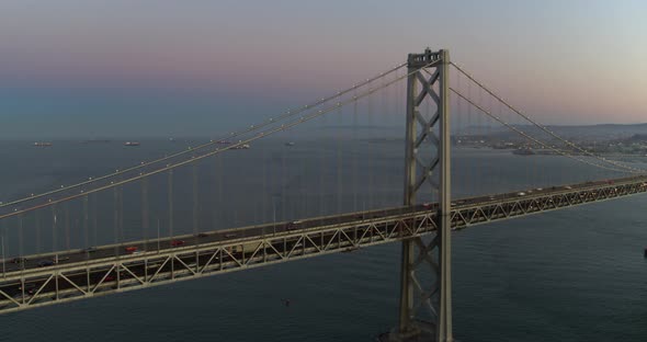 Panning Aerial of the San Francisco Bay Bridge and Skyline at Dusk