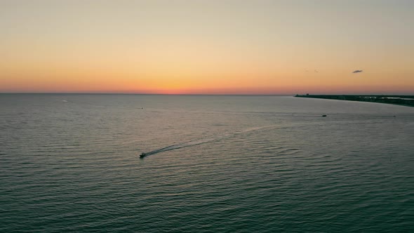 Aerial View Sunset on the Sea and the Beach From a Bird's Eye View