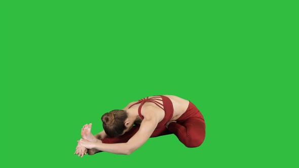 Young attractive woman practicing yoga sitting in Head