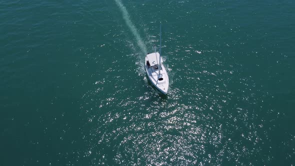 Aerial Top Down View of Speed Motor Boat on Open Sea at Summer Day