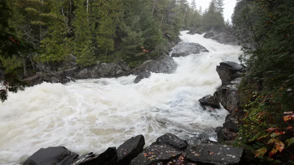 A Small Cascade on a Highland River Flows Through Stony Riverbed