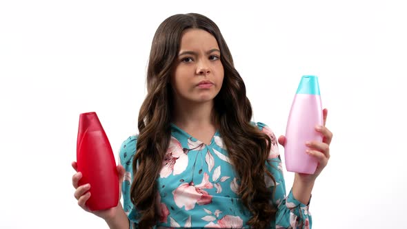 Cheerful Teen Girl Choosing Beauty Product of Shampoo or Shower Gel in Bottle Body Care