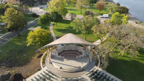 Close up then pan out over bandshell renovations in Riverside Park along Mississippi River.