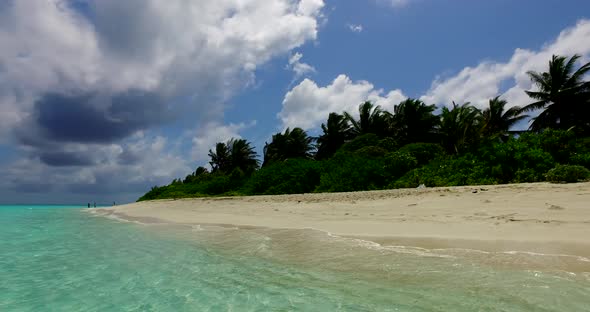 Daytime drone travel shot of a paradise sunny white sand beach and aqua turquoise water background i