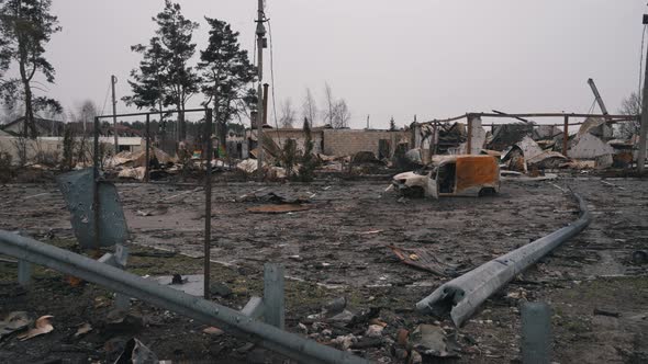 Destroyed Houses and a Car of Civilians in the War