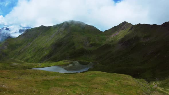 Drone view of a mountain lake in the Pyrenees during summer