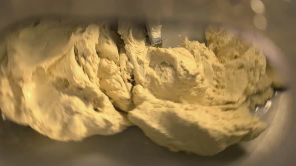 Close Up of Kneading Machine Preparing Dough