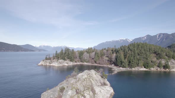 Aerial panoramic view of Whytecliff Park, West Vancouver, Canada, with white rocks in calm ocean wat