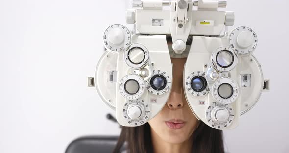 Young asian woman doing eye test 