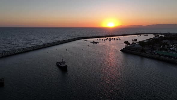 Pacific Coast Sunset Over A Marina With Boats