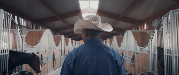 Cowboy in a Horse Stable