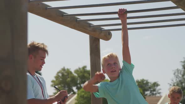 Caucasian boy training at boot camp