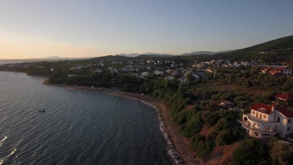 - Aerial View of Sea and Shore with Resort Town at Sunset, Greece