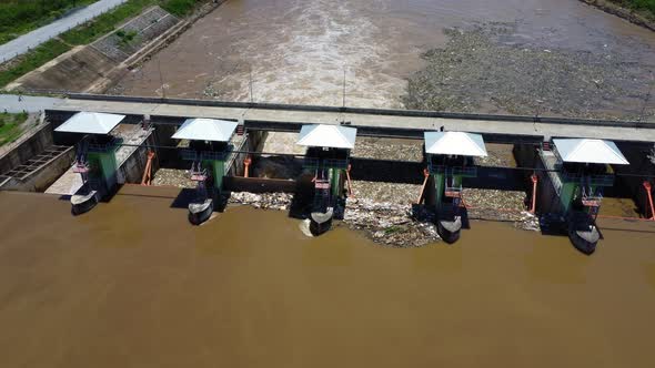Aerial view of water released from the drainage channel of the concrete dam is a way