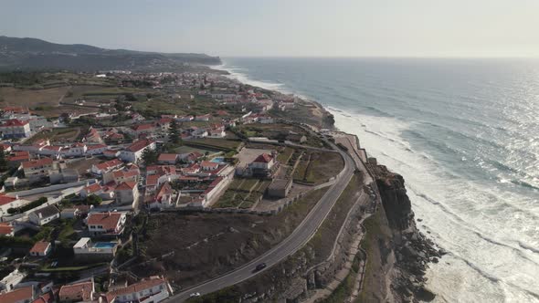 Picturesque town of Azenhas do Mar on high cliffside of Atlantic Ocean.