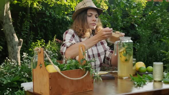 Woman Preparing Summer Lemonade Drink