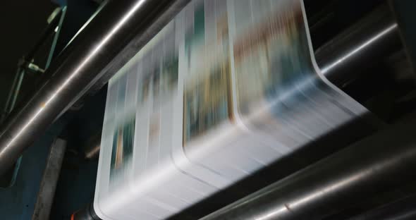 Print Plant Factory. Newspaper Printing at a Plant. Newspaper Printed on a Printing House Machine