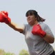 Happy overweight Asian woman wears Red boxing gloves Try to lose weight by exercise - VideoHive Item for Sale