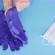Doctor putting on gloves and taking respiratory mask - VideoHive Item for Sale