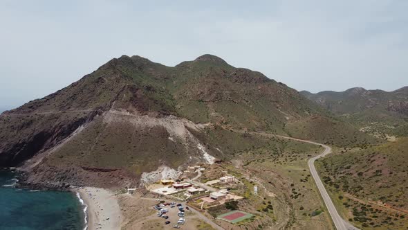 flying high around a mountain with coastal cliffs