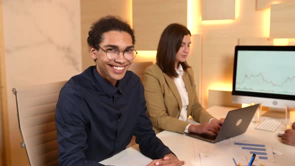 Handsome Young Man Wearing Glasses Looking at the Camera