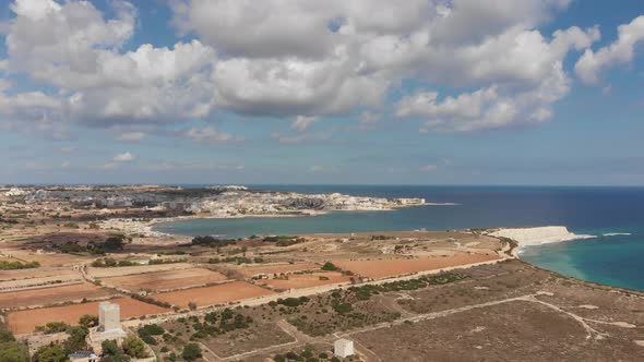 Aerial drone video from eastern Malta, Marsaxlokk area, Il-Hofra l-Kbira bay.