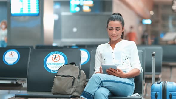 Passenger at the Airport, Using Her Tablet