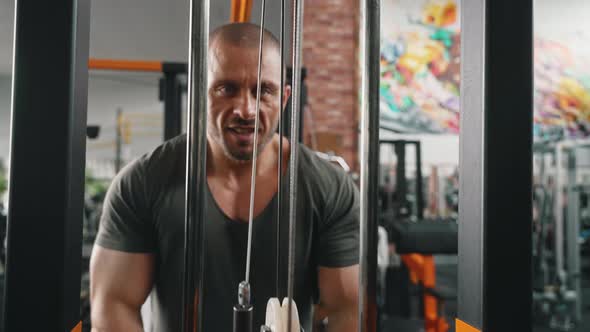 Bald Caucasian Wellbuilt Big Man Focusing on Exercise