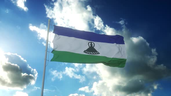 Flag of Lesotho Waving at Wind Against Beautiful Blue Sky