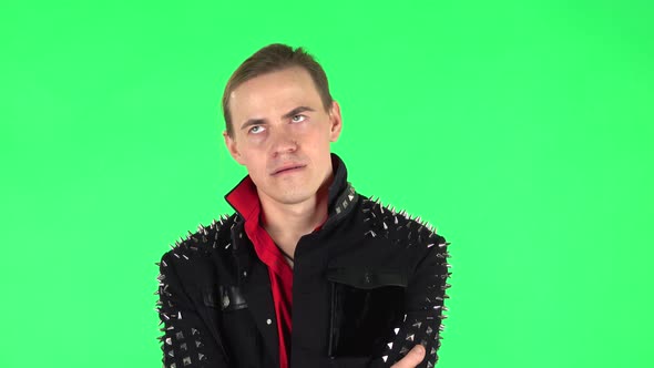 Guy Listens Carefully To Boring Information and Looks Around. Green Screen