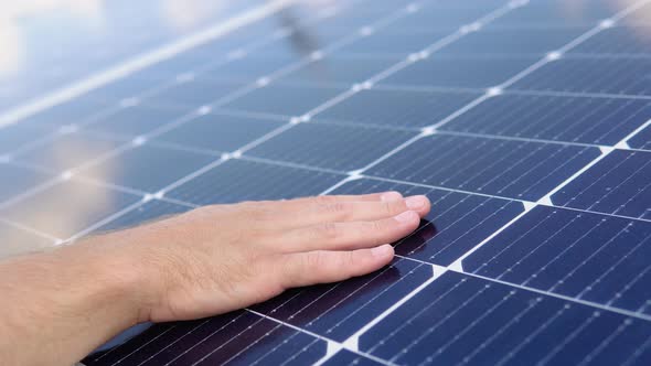 Close Up of an Young Engineer Hand is Checking an Operation of Sun and Cleanliness of Photovoltaic