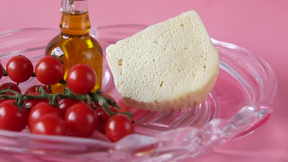 Cherry Tomato Cheese and Olive Oil on Table