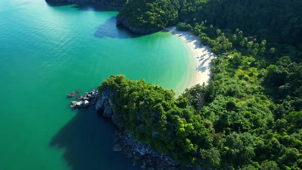 An aerial view of the unique turquoise waters and beautiful mountain coast