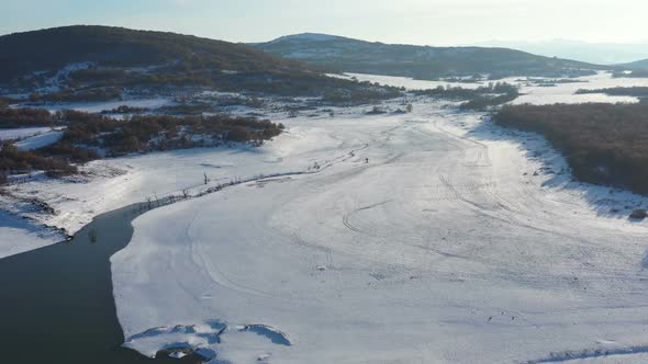 Flight Over A Dam On A Snowy Winter Day 