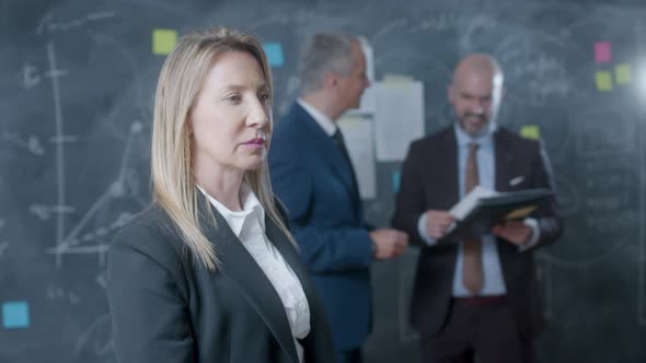 Happy Businesswoman Standing in Conference Room