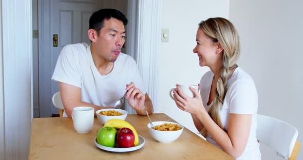 Happy couple having breakfast