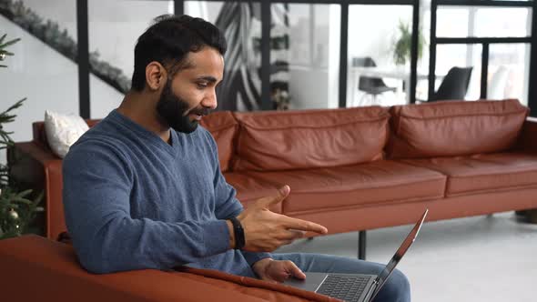 Indian Man Stay in Touch with a Work Team on the Distance