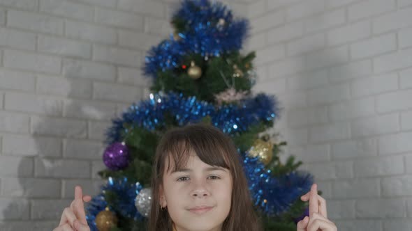 Young Girl Make a Dream at New Year at Home