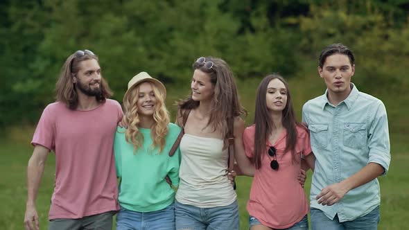 Happy Friends Having Fun Outdoors In Nature