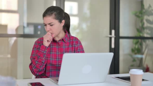 Indian Woman Coughing While Using Laptop