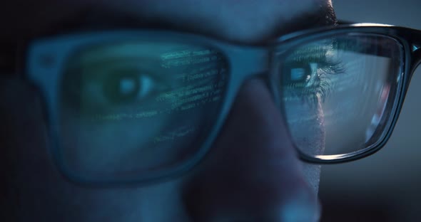 Man Coding with Reflection on glasses - 4k