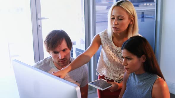 Executives discussing over computer digital tablet during a meeting 4k