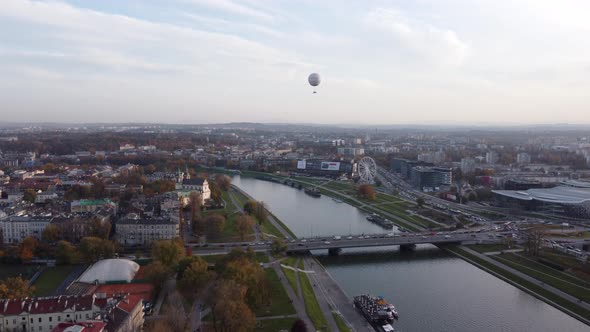 Hot Air Balloon Flying Over Vistula River And Krakow City In Poland. - aerial