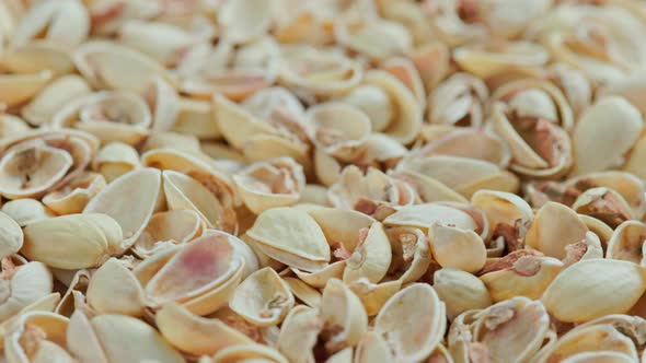 Looped Rotating Empty Pistachios Shells Full Frame Closeup Background