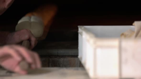 Close Up of Male Baker Preparing Bread at Food Factory