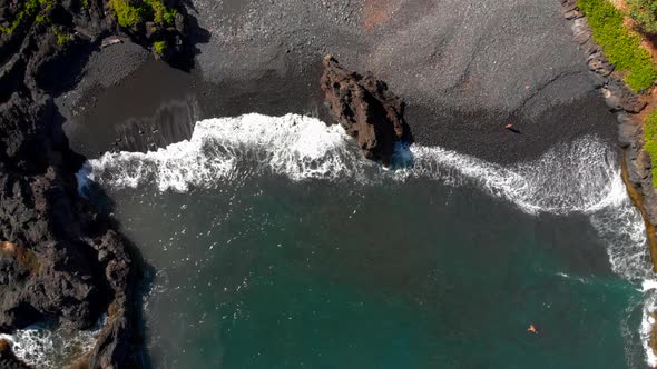 Beautiful relaxing 4k drone shot in Maui Hidden secluded beach with volcanic black sand private beac