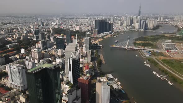Aerial View of Modern Ho Chi MInh Cityscape, riverside Buildings and Towers on Sunny Day, Establishi